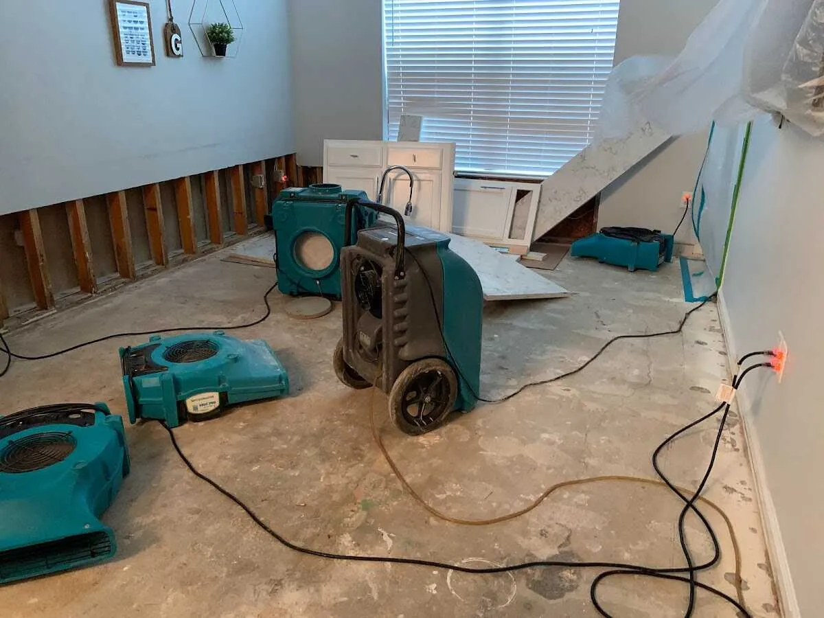 Dehumidifier in flood-cut room for Water Damage Restoration in Weston